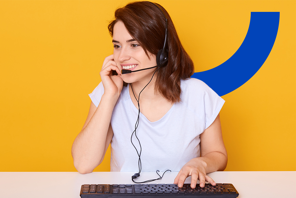 woman talking on phone with keyboard in remote contact center